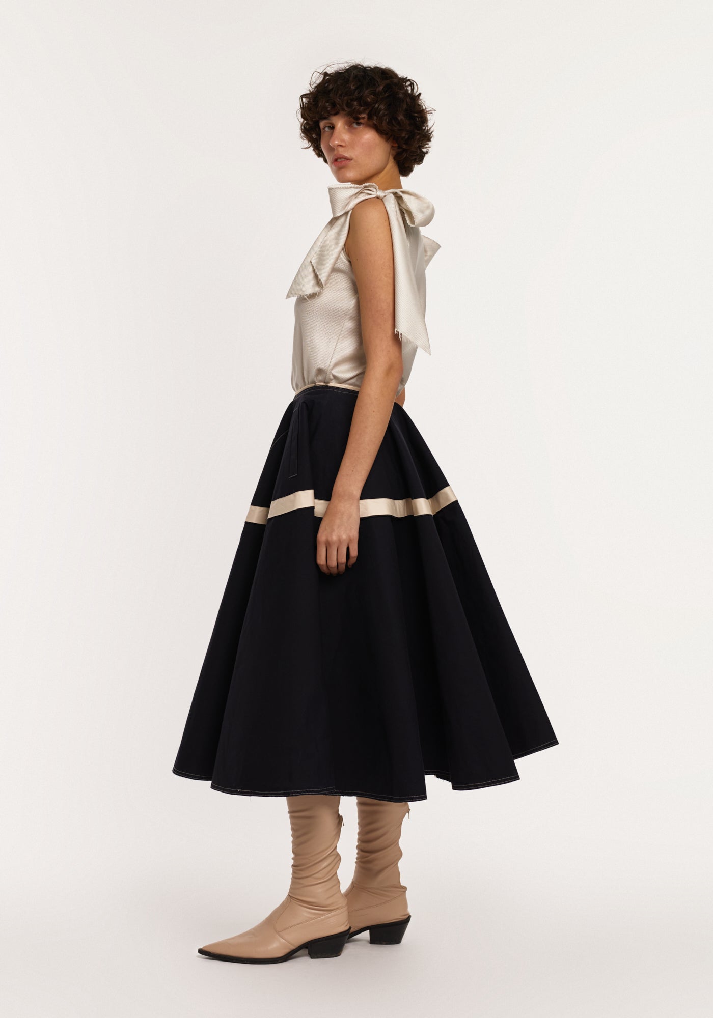 Light-green silk top with bows