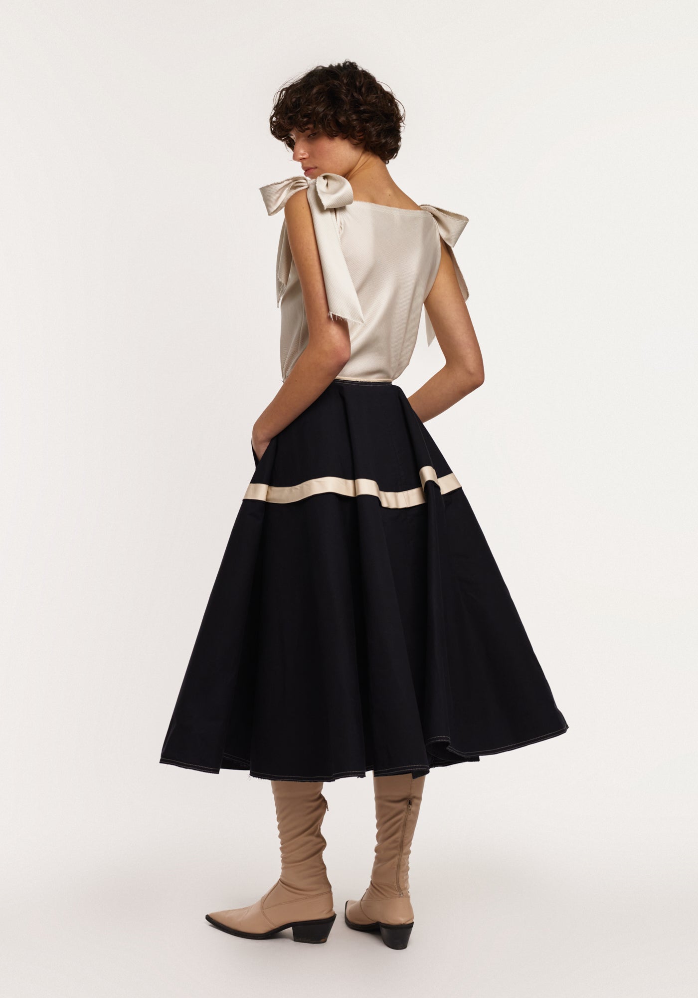 Light-green silk top with bows