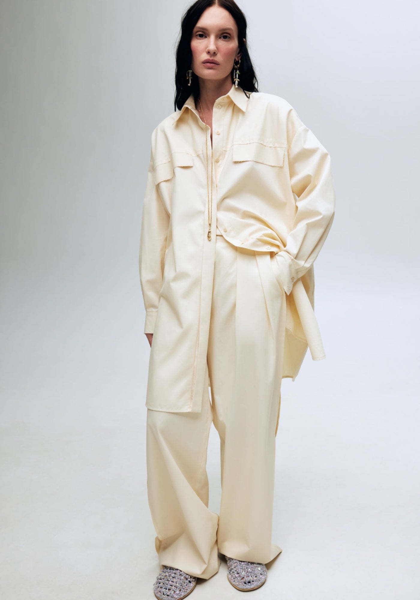 Брюки ванільні з шовковими лампасами